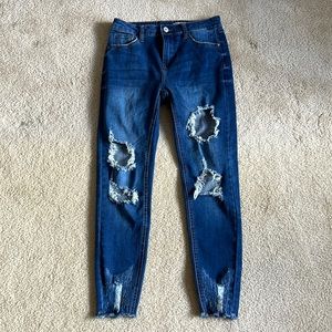 Blue denim jeggings distressed open holes. Size 5